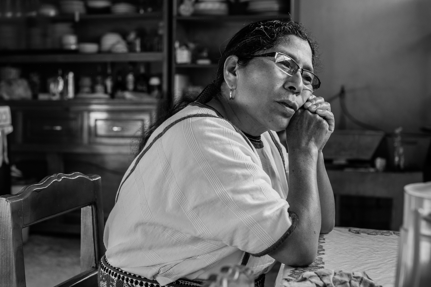 A Mixe woman reflects on her time in Milwaukee. She lived and worked there with her children until she had made enough money to build a house back home for her family. Her son stayed in Milwaukee with his wife and children, so she lives alone. Tamazulapam del Espiritu Santo, Oaxaca, Mexico.
