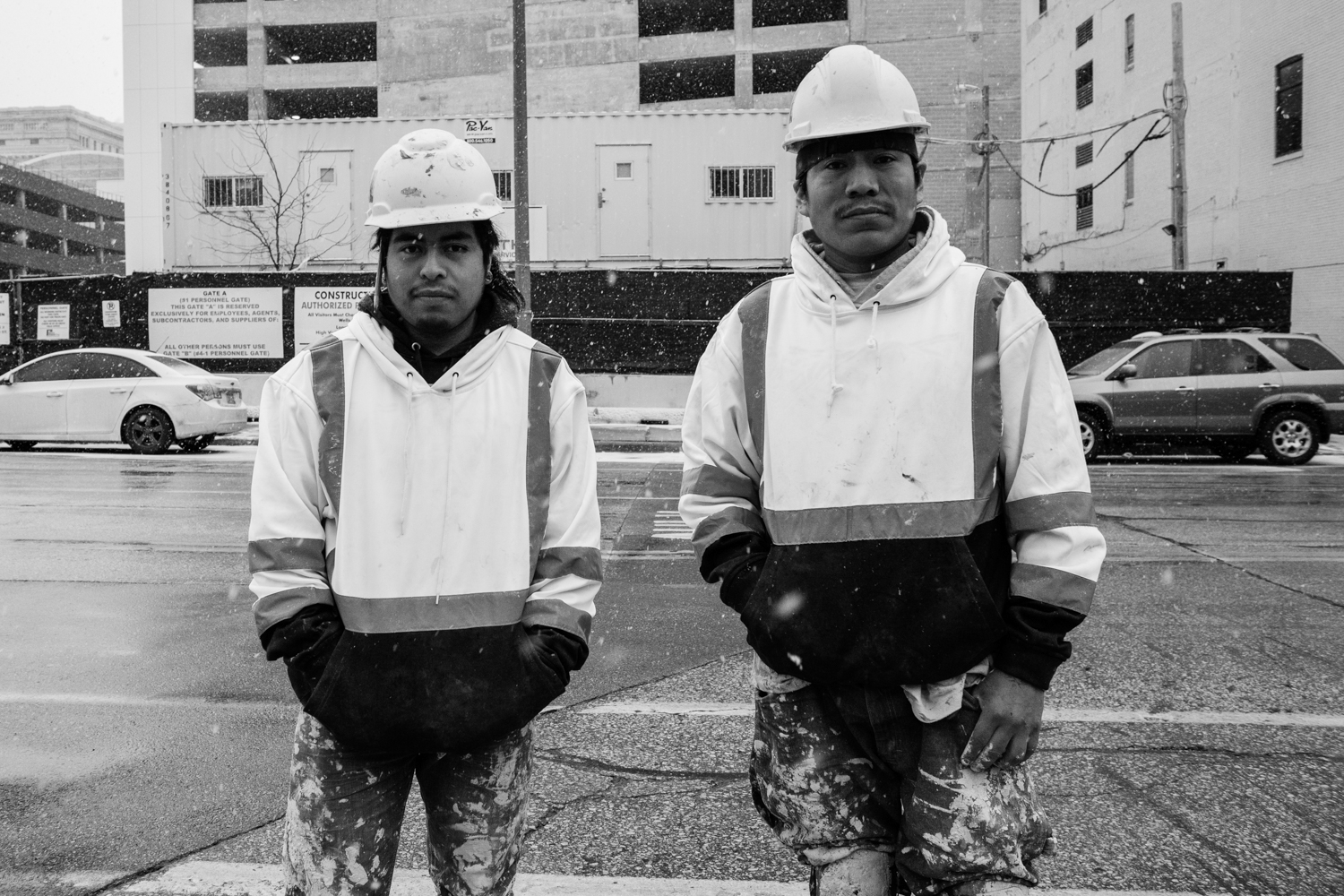 Mixe construction workers pose for a portrait in front of their worksite. Milwaukee, Wisconsin, USA.