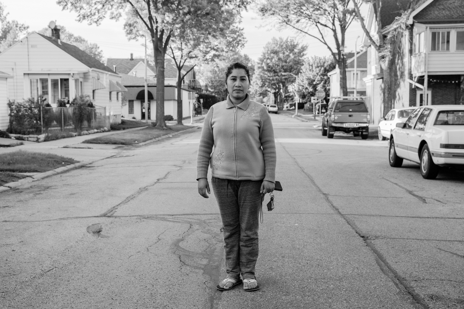 A single mom poses in the suburbs where she raises her two children. Milwaukee, Wisconsin, USA.