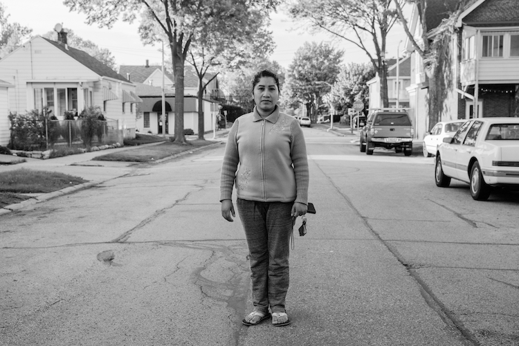 A single mom poses in the suburbs where she raises her two children. Milwaukee, Wisconsin, USA.